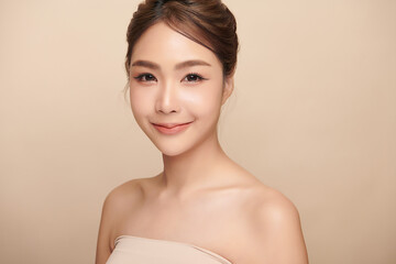 Beautiful young asian woman with clean fresh skin on beige background, Face care, Facial treatment, Cosmetology, beauty and spa, Asian women portrait.