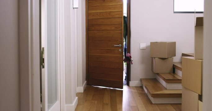 Children running through front door, excited about new house and moving, boy and girl with energy, property and mortgage. Family, relocation and people at home with real estate and happy kids