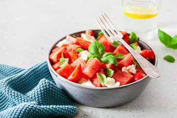 watermelon salad with strawberry mozzarella cheese basil. healthy summer dessert