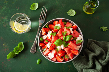 watermelon salad with strawberry mozzarella cheese basil. healthy summer dessert
