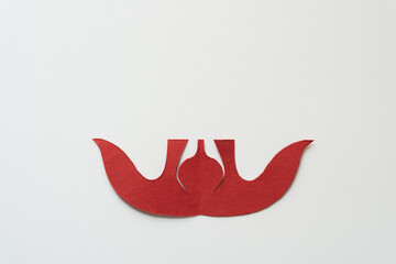 decorative red paper shape isolated on blank paper