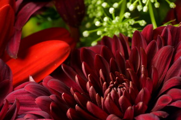 Beautiful Vintage Bouquet of roses and flowers with a filter over, used for love and passion and wedding bells. Shot on a reflective surface in a studio with a dark black background. 