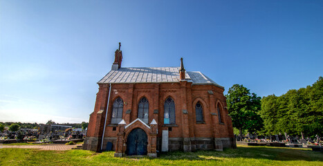General view and close-up of architectural details of a cemetery chapel built in the second half of the 19th century in Czerwin, Mazovia, Poland.