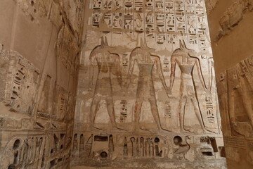 Inscriptions on the walls of the mortuary temple of Medinet Habu in Luxor in Egypt