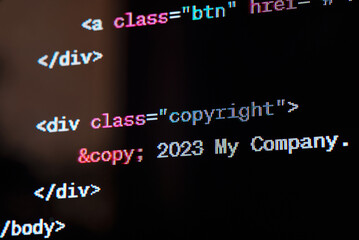 HTML website source code on the screen.