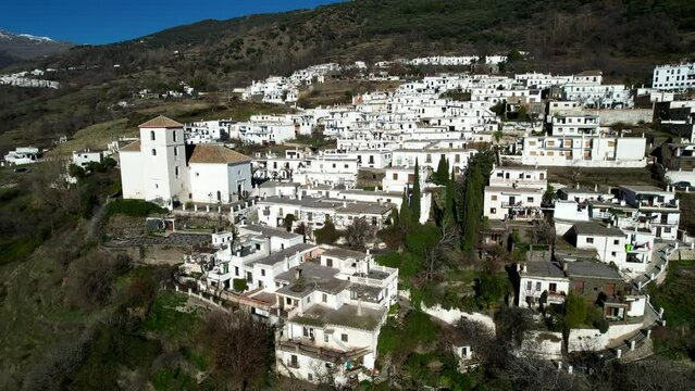 Aerial view above the beautiful villages of Capileira and Bubi&oacute;n in the gorge of the Poqueira in Andalusia Spain	