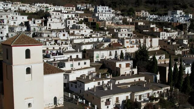 Aerial view above the beautiful villages of Capileira and Bubi&oacute;n in the gorge of the Poqueira in Andalusia Spain	