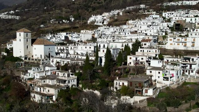 Aerial view above the beautiful villages of Capileira and Bubi&oacute;n in the gorge of the Poqueira in Andalusia Spain	