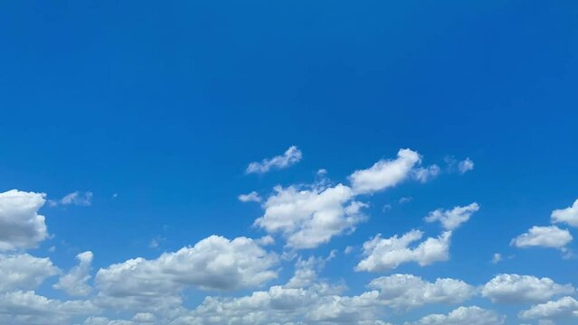 Blue sky with clouds and blank space for content, Summer blue sky time lapse. Nature weather blue sky. White clouds background. Cloud time lapse background