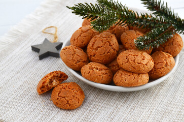 Traditional Italian almond cookies amaretti on a white background with copy space.Famous amarettini cookie biscuits.Delicious Christmas pastry popular in Italy.Selective focus.