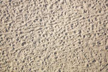 Background yellow sand with human footprints