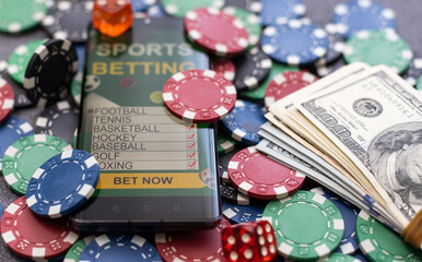 Playing cards, poker chips, and dice, the smartphone. Online casino concept. Gambling. Background.