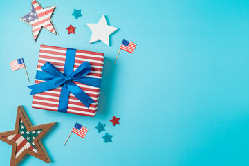Fototapeta na wymiar Happy Independence Day, 4th of July background with gift box, stars and USA flag. Top view, flat lay