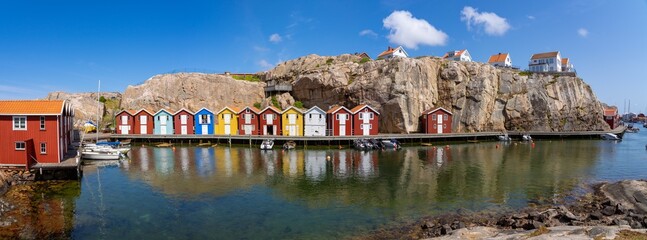 Panoramic view over the famous Smögenbryggan with colorful boathouses in Smögen on the Swedish West Coast. 
99 Megapixel photo.