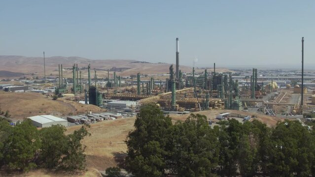 The Benicia Oil Refinery stands in stark contrast to the dry California hills
