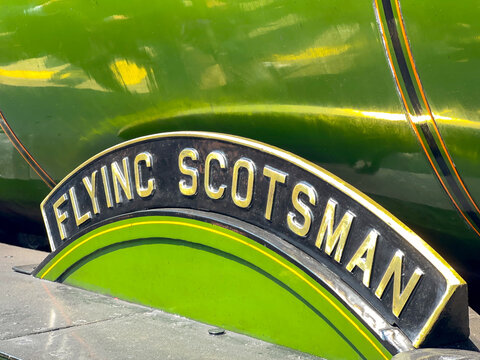 Cardiff, Wales - June 2023: Close up view of the name plate on The Flying Scotsman steam engine