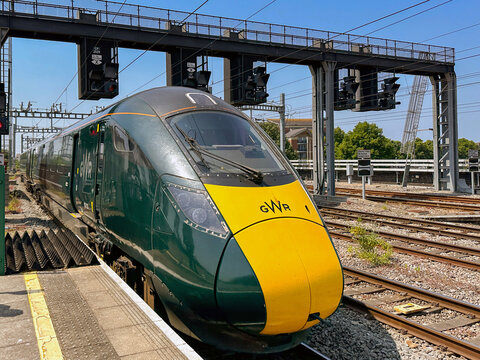 Cardiff, Wales - June 2023: High speed train operated by Great Western Railway leaving Cardiff Central railway station