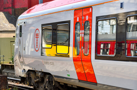 cardiff, Wales - 8 June 2023: from view of a new train operated by Transport for Wales on the South Wales Metro. Other trains and coaches are reflected in its windows.