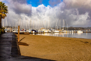 Sausalito waterfront and harbor, a city in the San Francisco Bay Area in Marin County in the state of California. Boats with houses on the Golden Gate Bridge in the USA. Boat concept.