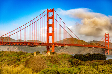 Golden Gate Bridge in the city of San Francisco, in the state of California in the USA, under a blue sky and beautiful clouds. Concept America.