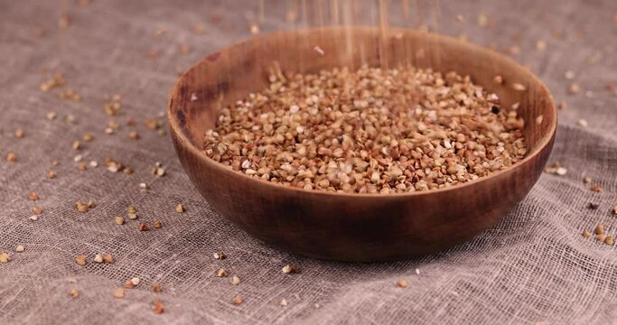 a large amount of low-quality processing of buckwheat groats close-up, Poorly cleaned buckwheat groats for cooking porridge