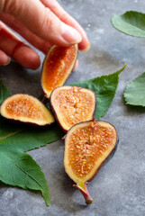 Food Photo, Fresh figs. Hand taking fresh delicious fruit, selective focus 