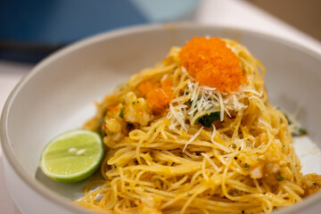 Fototapeta na wymiar Spaghetti spicy shrimp with tobiko or flying fish roe