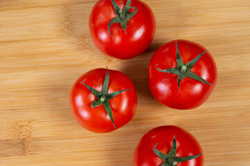 tomatoes back ground healthy food over a wood plate