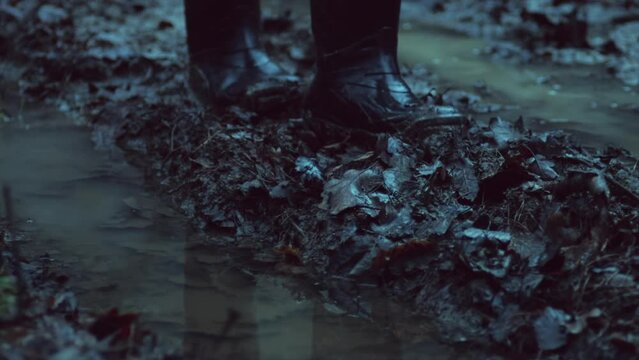 Walking through a mud in rubber boots on a forest road. High quality binaural audio recording. ASMR style video and sound.
