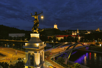 Scenic aerial view of Vilnius Old Town and Neris river at nightfall. Night view of Vilnius, Lithuania.