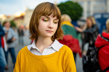 Pretty teenage girl wearing tricolor eye make-up on Lithuanian Statehood Day.