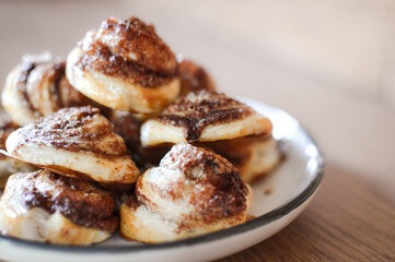 freshly baked cinnamon rolls with powder sugar 