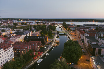 Naklejka premium Scenic aerial view of the Old town of Klaipeda, Lithuania in evening light. Klaipeda city port area and it's surroundings on summer day.