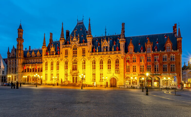 Provincial Court building on market square (Grote markt) at night, Bruges, Belgium