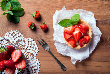 cupcake with strawberries on a set table