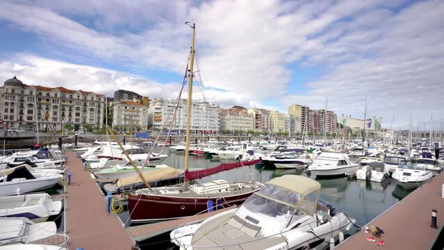 Santander, SPAIN - August 21 2022: Beautiful port of Santander. Boats docked. Travel destination in North of Spain. Panoramic view of marina and part of the city center. Stabilized static video