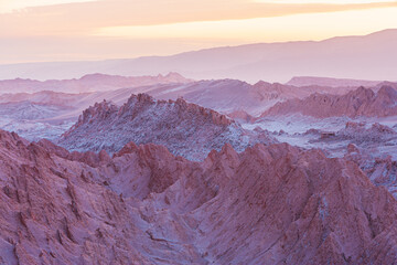 Sunrise over the strongly eroded badlands of the Moon Valley (Valle de la Luna) in the vicinity of...