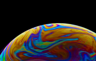 Obraz na płótnie Canvas Colorful soap bubble on black background.