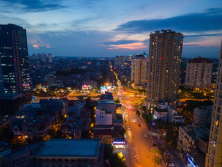 Aerial view of Hanoi Downtown Skyline, Vietnam. Financial district and business centers in smart urban city in Asia. Skyscraper and high-rise buildings at night.