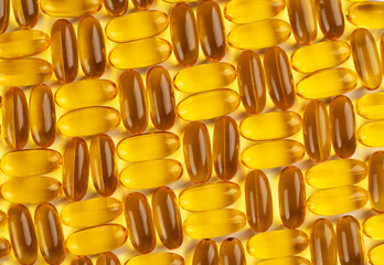 Seamless pattern of omega 3 capsules on a white background.