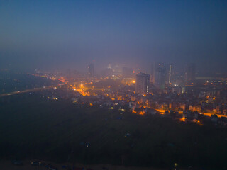 Aerial view of Hanoi Downtown Skyline, Vietnam. Financial district and business centers in smart urban city in Asia. Skyscraper and high-rise buildings at night.