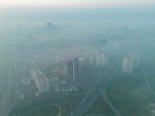 Aerial view of Hanoi Downtown Skyline with fog mist, Vietnam. Financial district and business centers in smart urban city in Asia. Skyscraper and high-rise buildings.