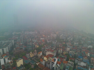 Aerial view of Hanoi Downtown Skyline with fog mist, Vietnam. Financial district and business centers in smart urban city in Asia. Skyscraper and high-rise buildings.