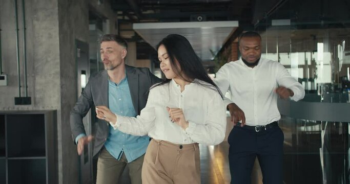  Dance in the office during a break. The image of a happy company life in the office