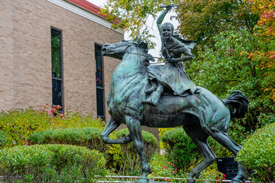 Danbury, CT - Oct. 17, 2022: Bronze Sibyl Ludington statue at Danbury Public Library. 16 year old Sibyl rode through Putnam County, New York, to warn soldiers of a British attack on Danbury.