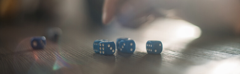 Playing dice and men's hands close-up. Game of dice.