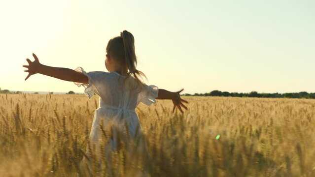 little girl daughter child kid run through wheat field with hands raised up, happy family dream flies pilot plane, child wants become pilot plane, family nature, happy family concept, dreams flight.