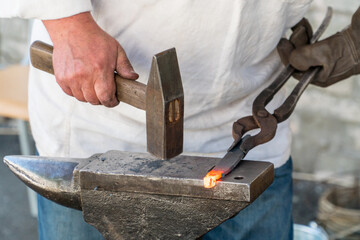 Blacksmith at work making horseshoe in Ukraine.