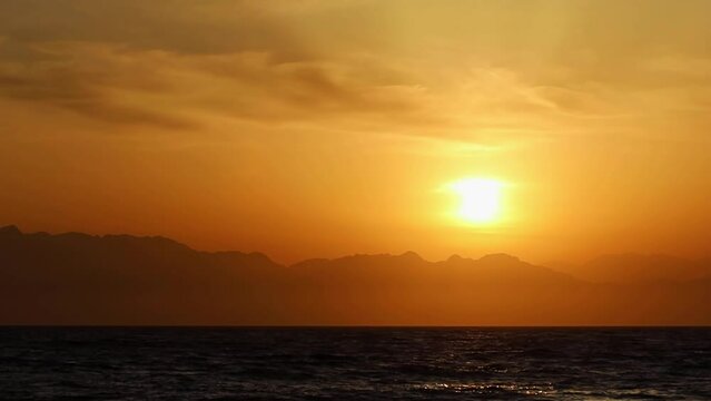Spectacular sunrise over the mountains in Saudi Arabia by Red Sea coast.