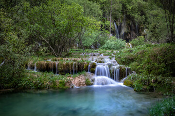 Scenic waterfalls of the source of the Cuervo River in the Serrania de Cuenca natural park in Cuenca, Spain